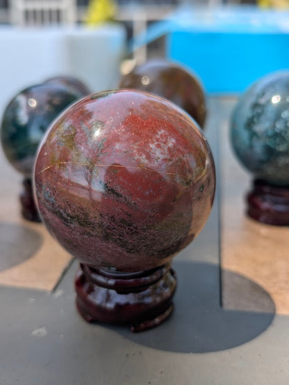 Macro profile of 66mm Ocean Jasper sphere from Madagascar showing internal mineral structure.