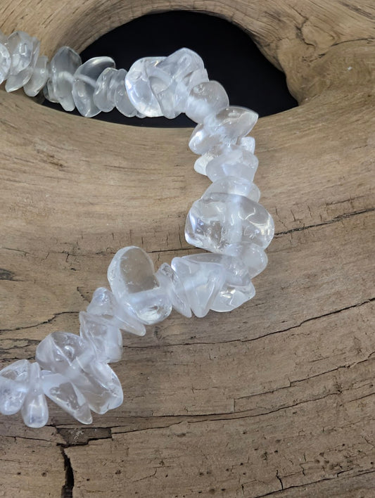 Macro view of clear optical calcite chips showing natural rhombohedral cleavage and vitreous luster.