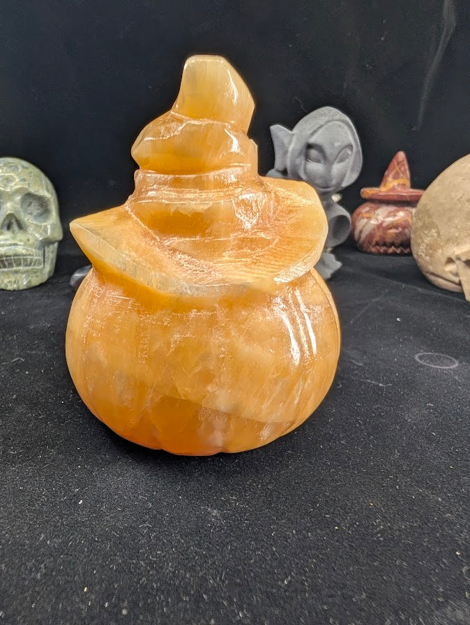 Orange Calcite Pumpkin with Witch Hat – Back View highlighting polished calcite surface