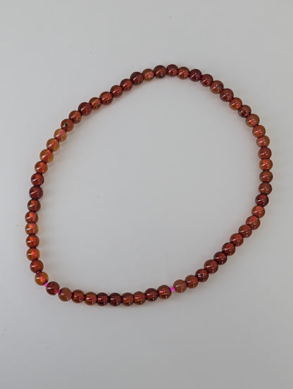 3mm peach garnet bracelet with apricot tones on stretch cord