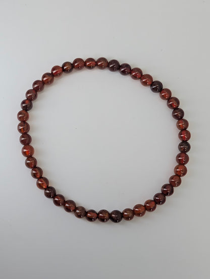 4mm peach garnet bracelet with copper-amber color and high polish