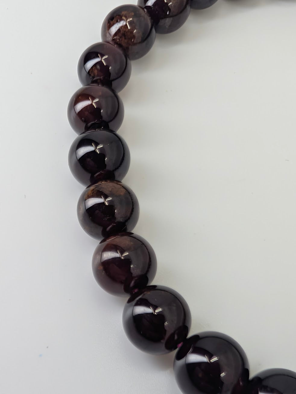 Close-up of 7mm peach garnet beads showing gemmy translucence