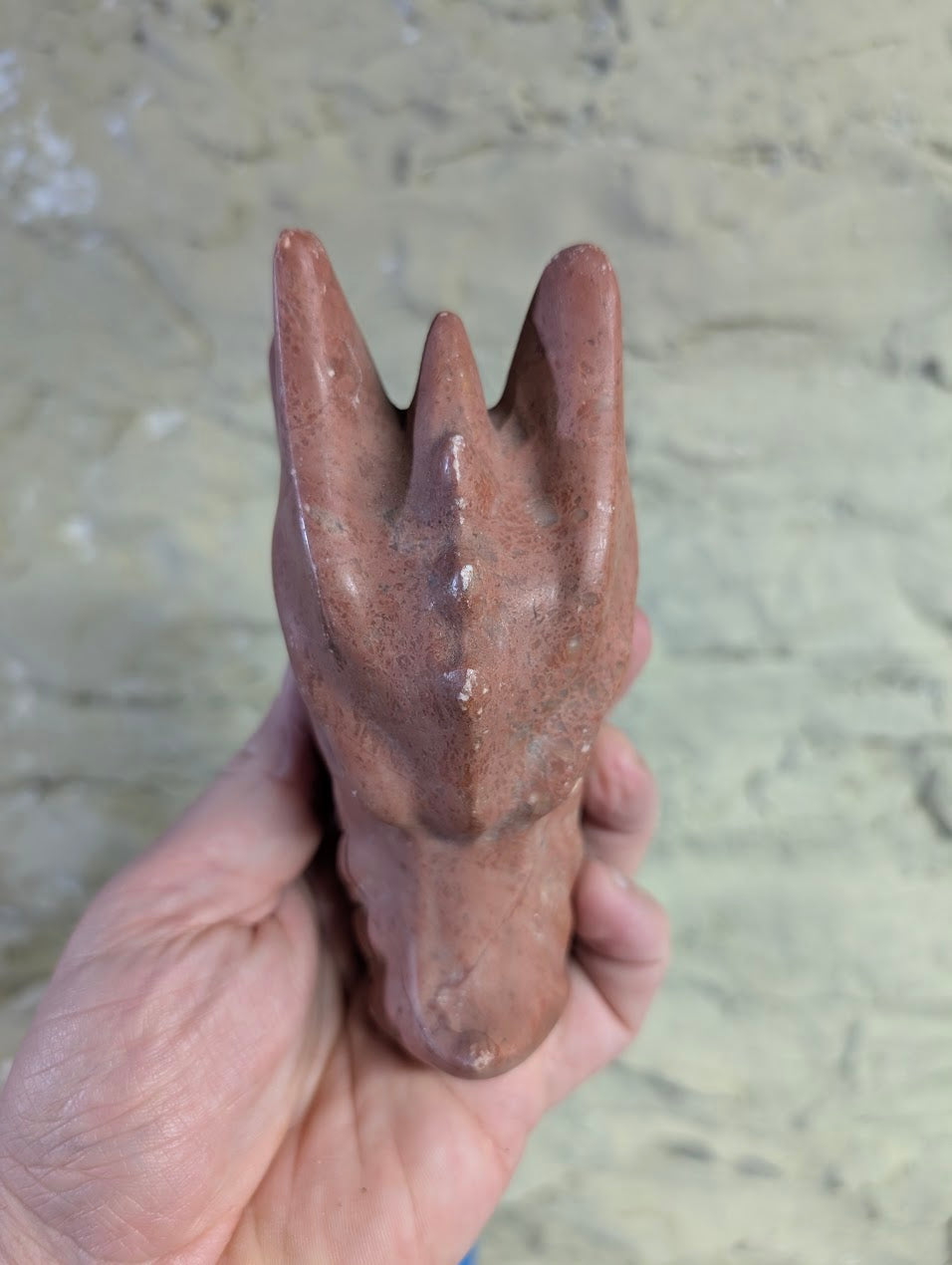 Peach Jasper dragon head carving polished surface texture