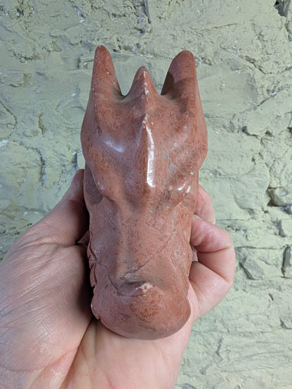 Peach Jasper dragon head carving frontal profile