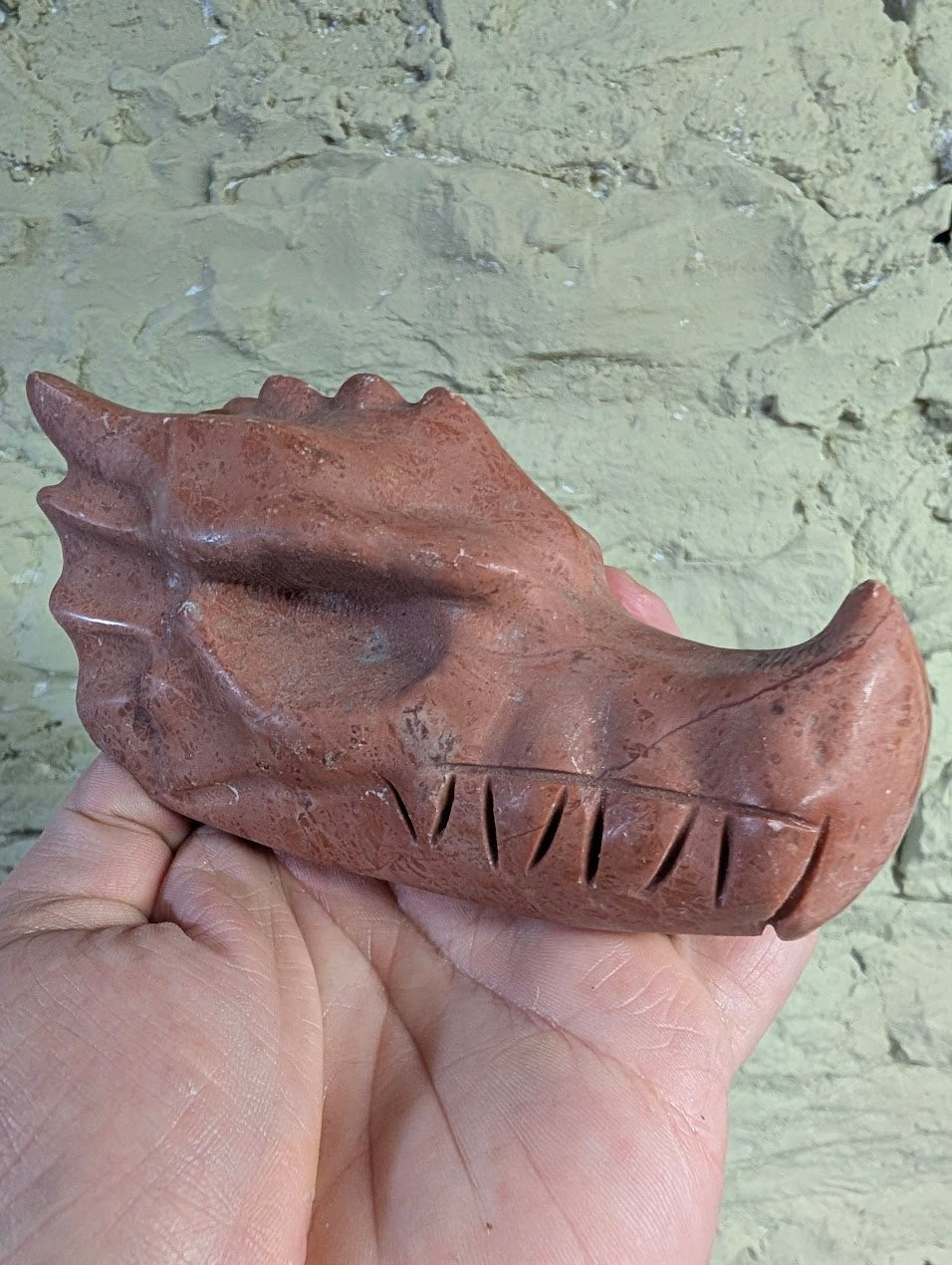  Brecciated Peach Jasper dragon head carving side view