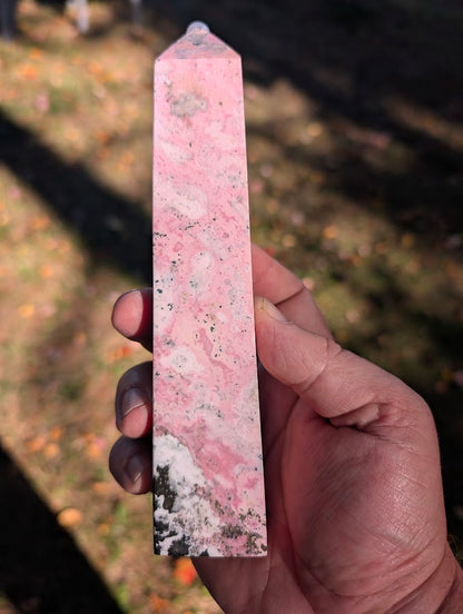 Back view of rhodonite tower #3 highlighting cloud-like pink textures and polished finish
