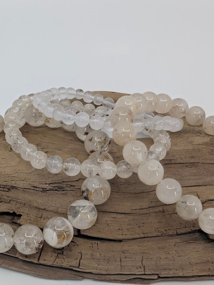 Petroleum Quartz Bracelet detail showing visible oil and carbon inclusions in clear quartz beads