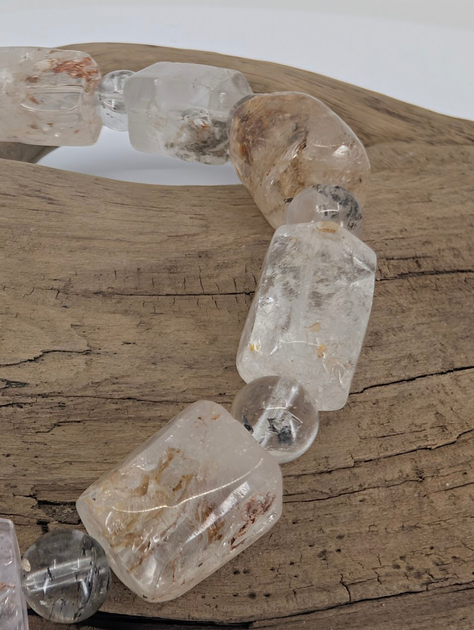 Freeform petroleum quartz beads showing natural inclusions and clarity.