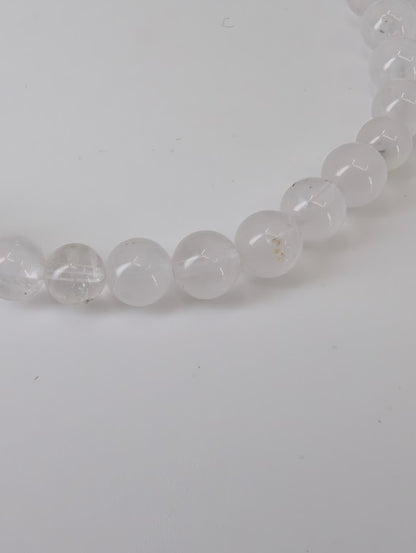 Petroleum Quartz Bracelet detail showing visible oil and carbon inclusions in clear quartz beads