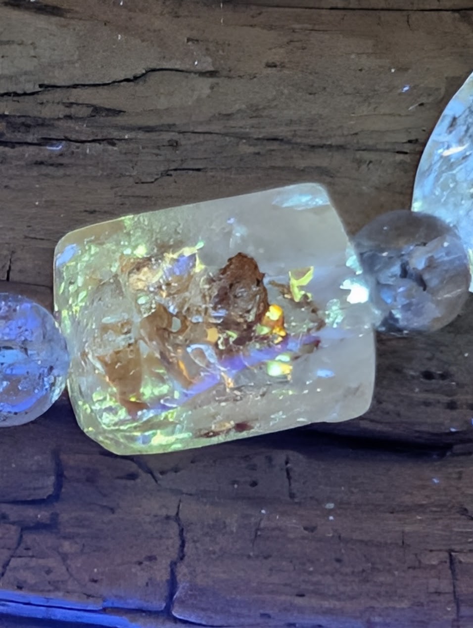 UV-reactive petroleum inclusions glowing bright yellow and blue.