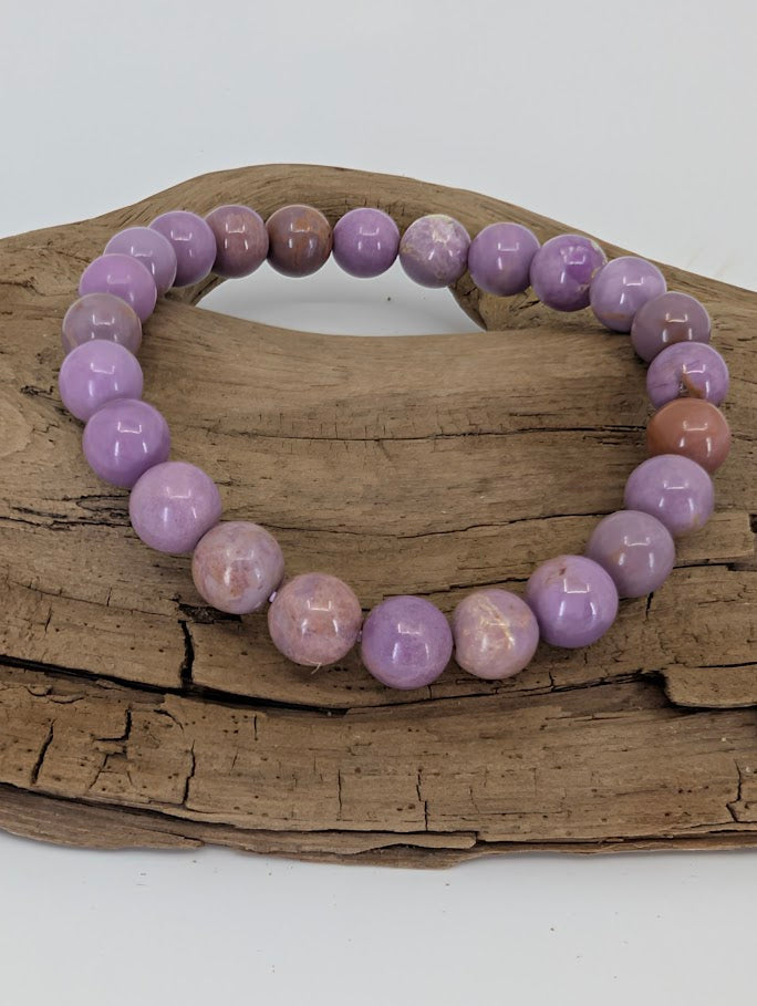 Front view of 8mm Phosphosiderite bracelet displaying pastel lavender beads