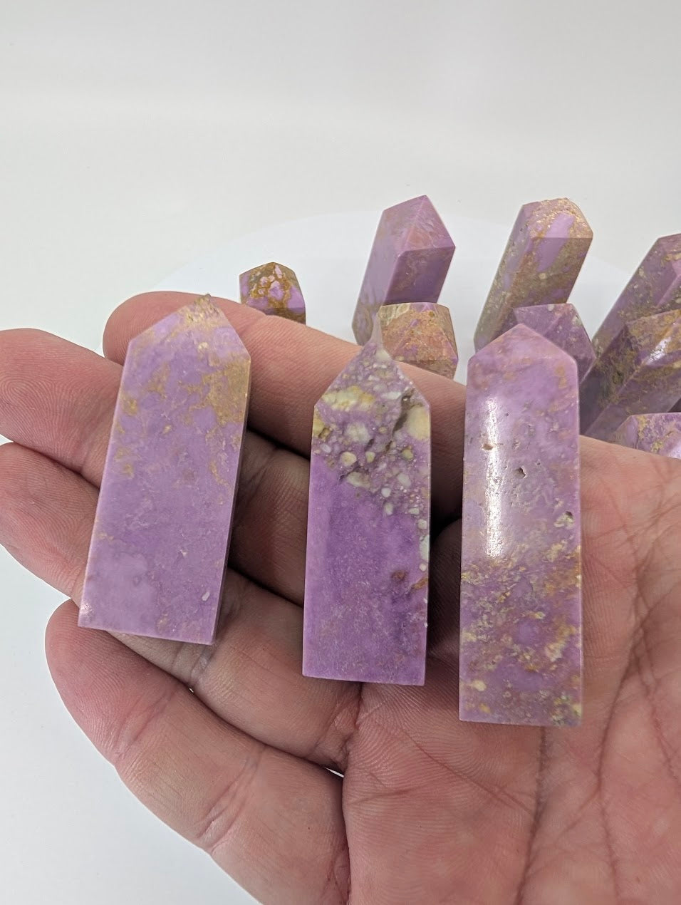 Front view of mini phosphosiderite towers in soft purple tones
