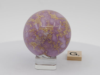 Polished 55mm Chilean Phosphosiderite sphere, perfect for high-end mineral display or decor.