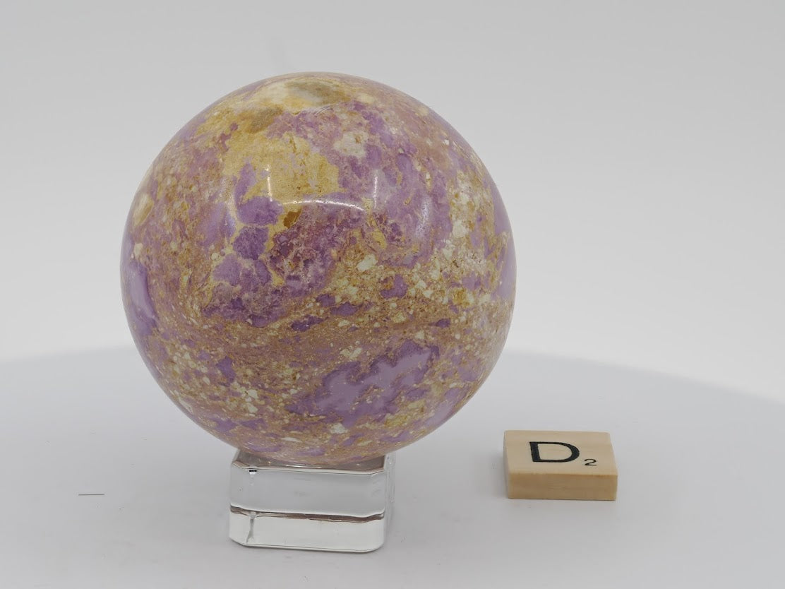 Polished 62mm Phosphosiderite sphere showing natural contrast between orchid-purple and earthy matrix.