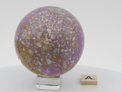 74mm Phosphosiderite sphere showcasing natural tan matrix and white speckled inclusions.