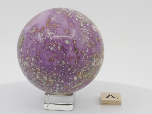 Detailed view of a 74mm Phosphosiderite sphere showing rare natural mosaic patterns and iron phosphate structure.