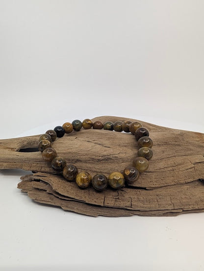 8mm Pietersite stretch bracelet with golden-brown chatoyancy on driftwood