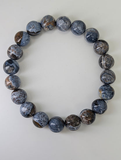 Top-down image of 10 mm Blue Pietersite bracelets with stormy color pattern