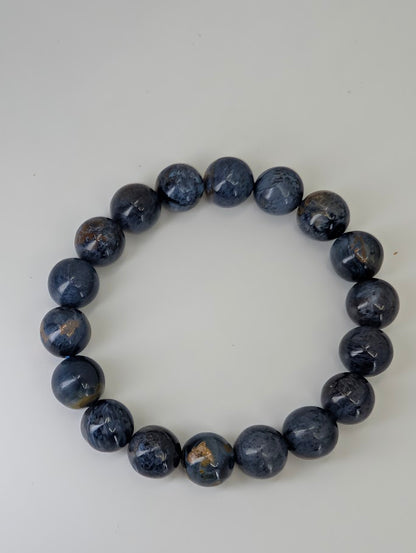 Top-down image of 11 mm Blue Pietersite bracelets with stormy color pattern