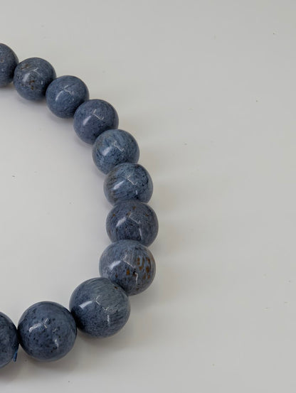 Blue Pietersite 8MM bracelet with silver and bronze veining showing optical contrast