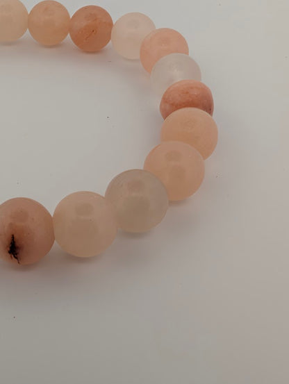 Macro angle of Pink Aventurine 8mm bracelet highlighting polish and gentle translucency