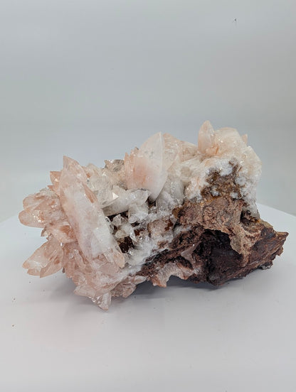 All-natural swallowtail pink calcite cluster from Hunan China - angled view