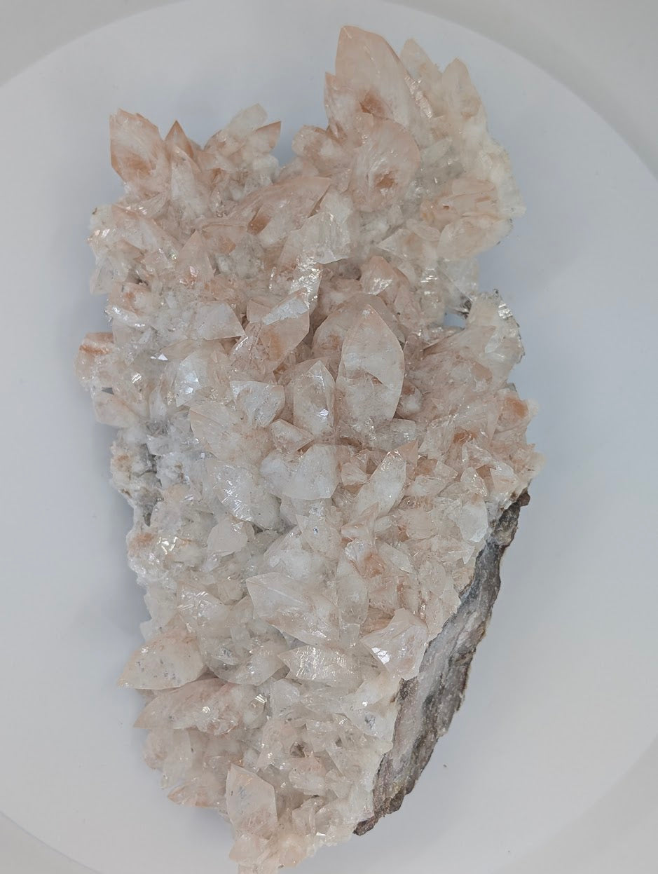 All-natural swallowtail pink calcite cluster from Hunan China - angled view