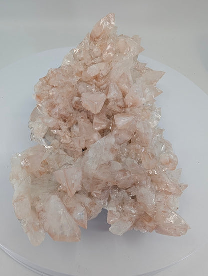 All-natural swallowtail pink calcite cluster from Hunan China - angled view