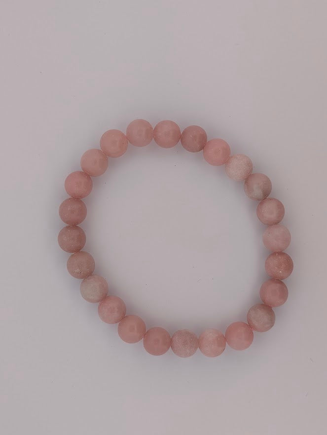 Top view of Pink Opal stretch bracelet, uniform pastel tone