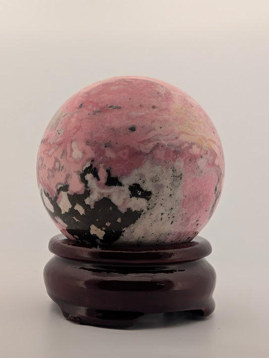 Front view showing bold black veining on soft pink surface