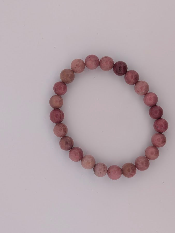 Top view of pink petrified wood stretch bracelet