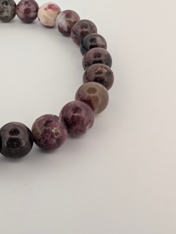 Detail of Pink Tourmaline bracelet highlighting natural inclusions and polish