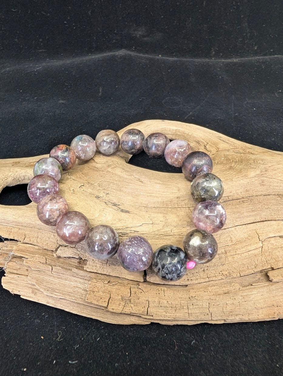 Full view of a 12mm Pink Tourmaline in matrix bracelet featuring mottled pink, mauve, and grey beads.