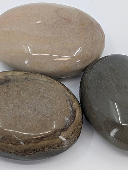 Close-up of Polychrome Jasper Palm Stone highlighting layered tones