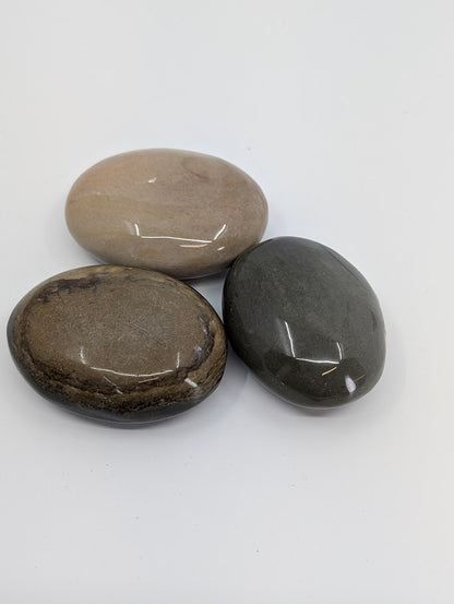 Group of Polychrome Jasper Palm Stones showing beige and grey swirls