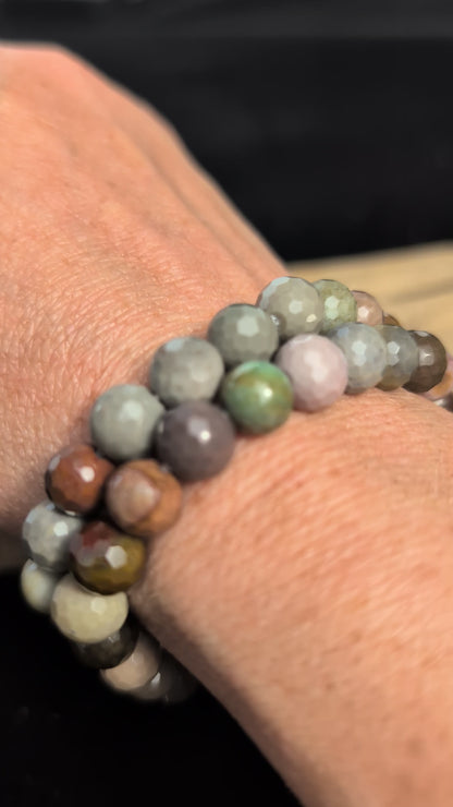 Video showcasing the highly reflective faceted texture and varied earthy desert tones of an 8mm Polychrome Jasper beaded stretch bracelet worn on a wrist.
