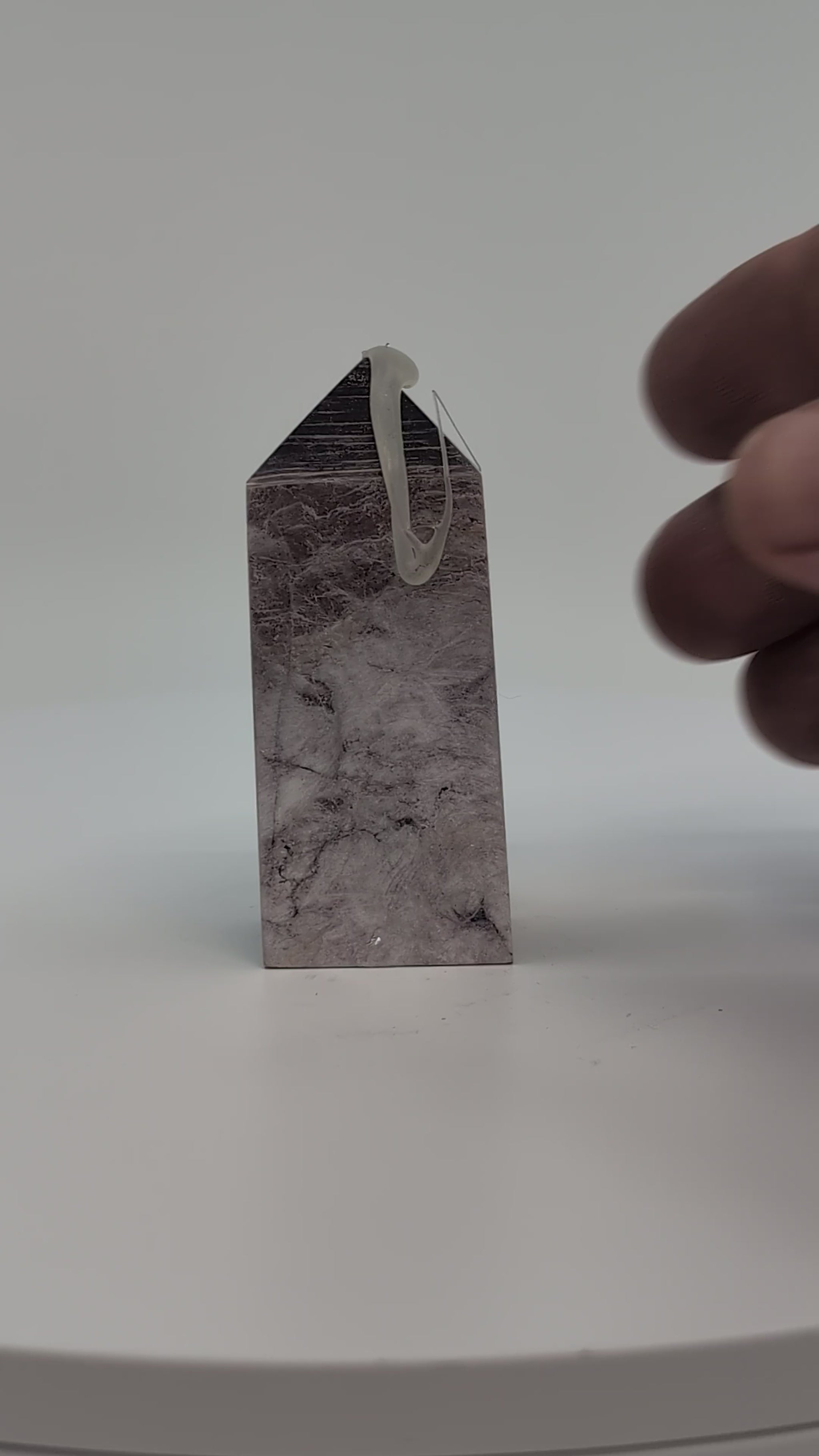 360° video showing the front of polished Lepidolite tower with lavender tones and silvery mica sheen