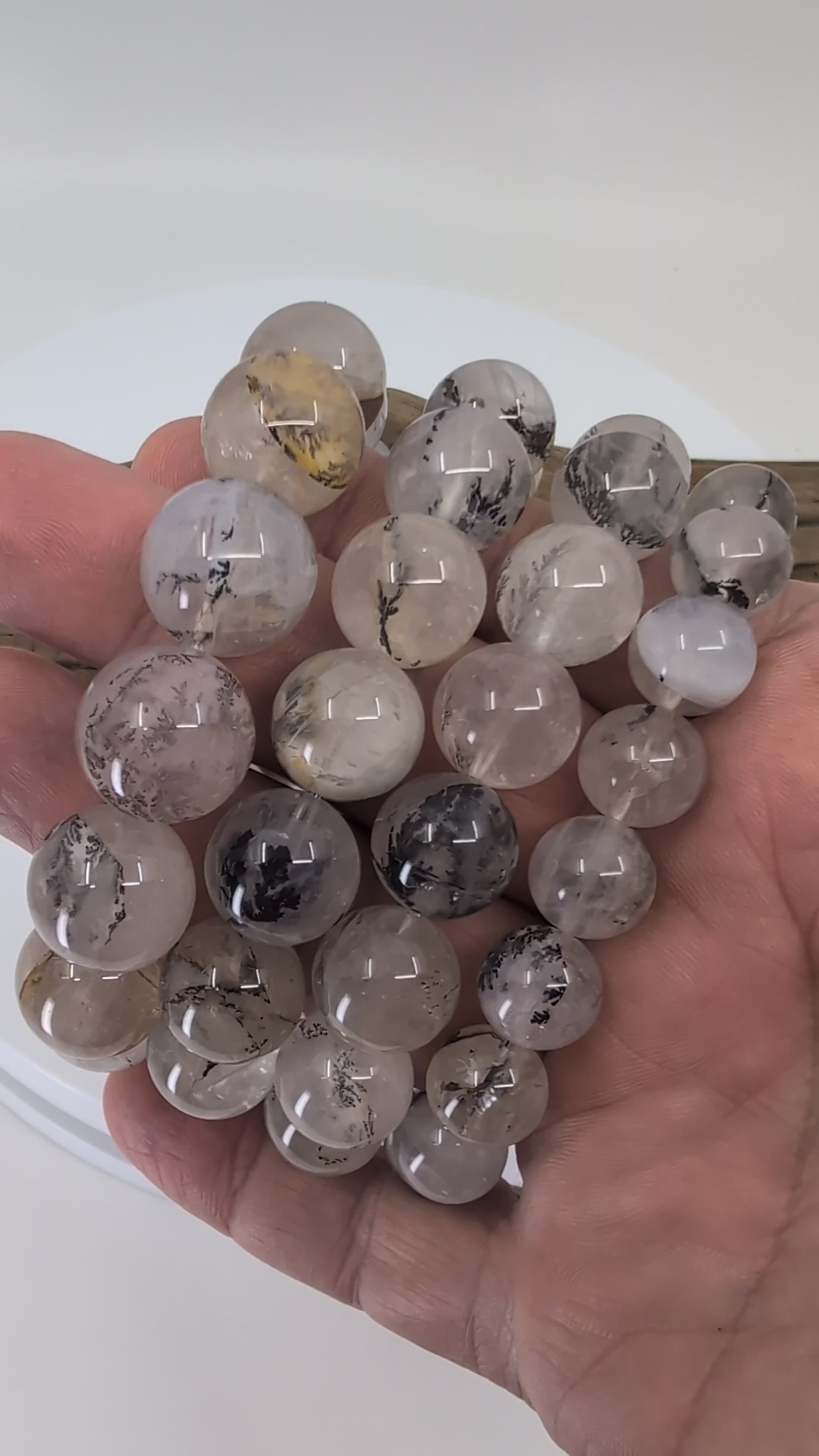 Discover the natural beauty of dendritic quartz. Each bracelet reveals unique manganese oxide “forest” inclusions suspended inside clear quartz, creating miniature landscape scenes within every bead. Available in 8 mm, 14 mm, 15 mm, and 16 mm sizes, these bracelets are all-natural, one-of-a-kind, and crafted from high-quality bead-grade quartz. A perfect blend of grounding energy and geological artistry.