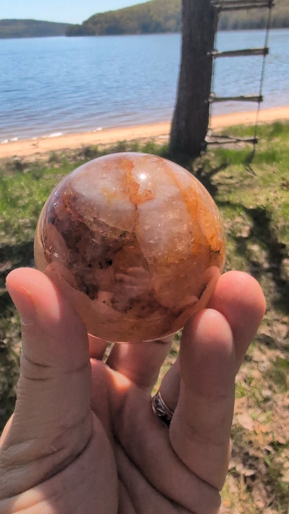 Video showcase of premium Golden Healer quartz spheres from Brazil in natural daylight.