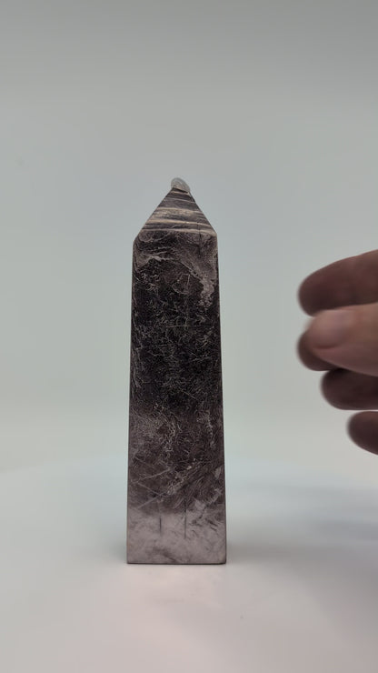 360° rotation video of polished Lepidolite tower (Purple Mica) from Minas Gerais, Brazil, showing lavender shimmer, layered mica texture, and smooth reflective finish.