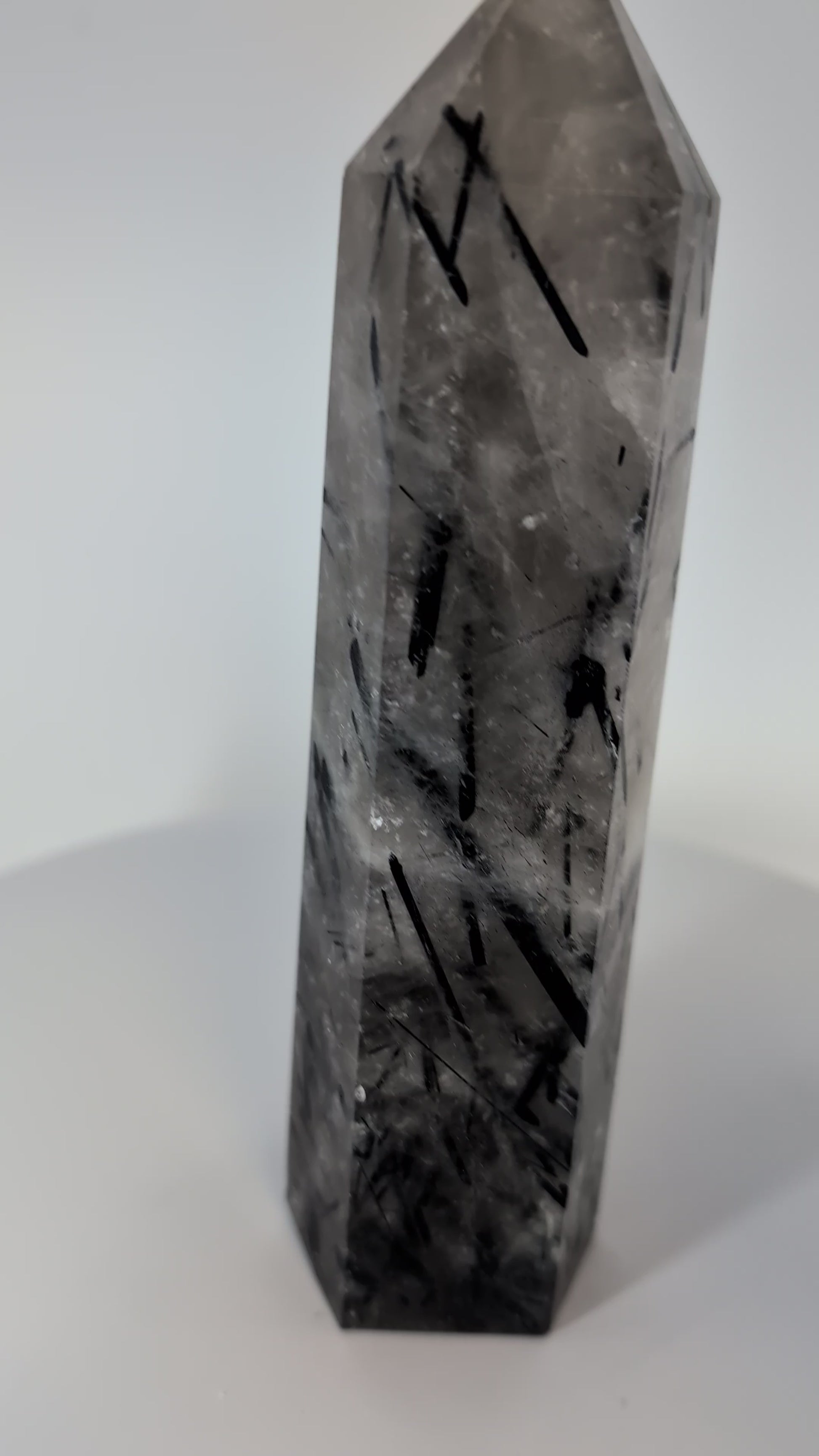 360-degree view of 17 cm Black Tourmaline in Quartz tower from Brazil showing full polish and inclusion density.