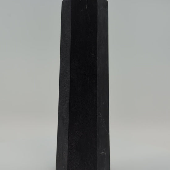 Showcase video of heavy 535g deep-black Shungite tower displaying uniform surface and energy presence.
