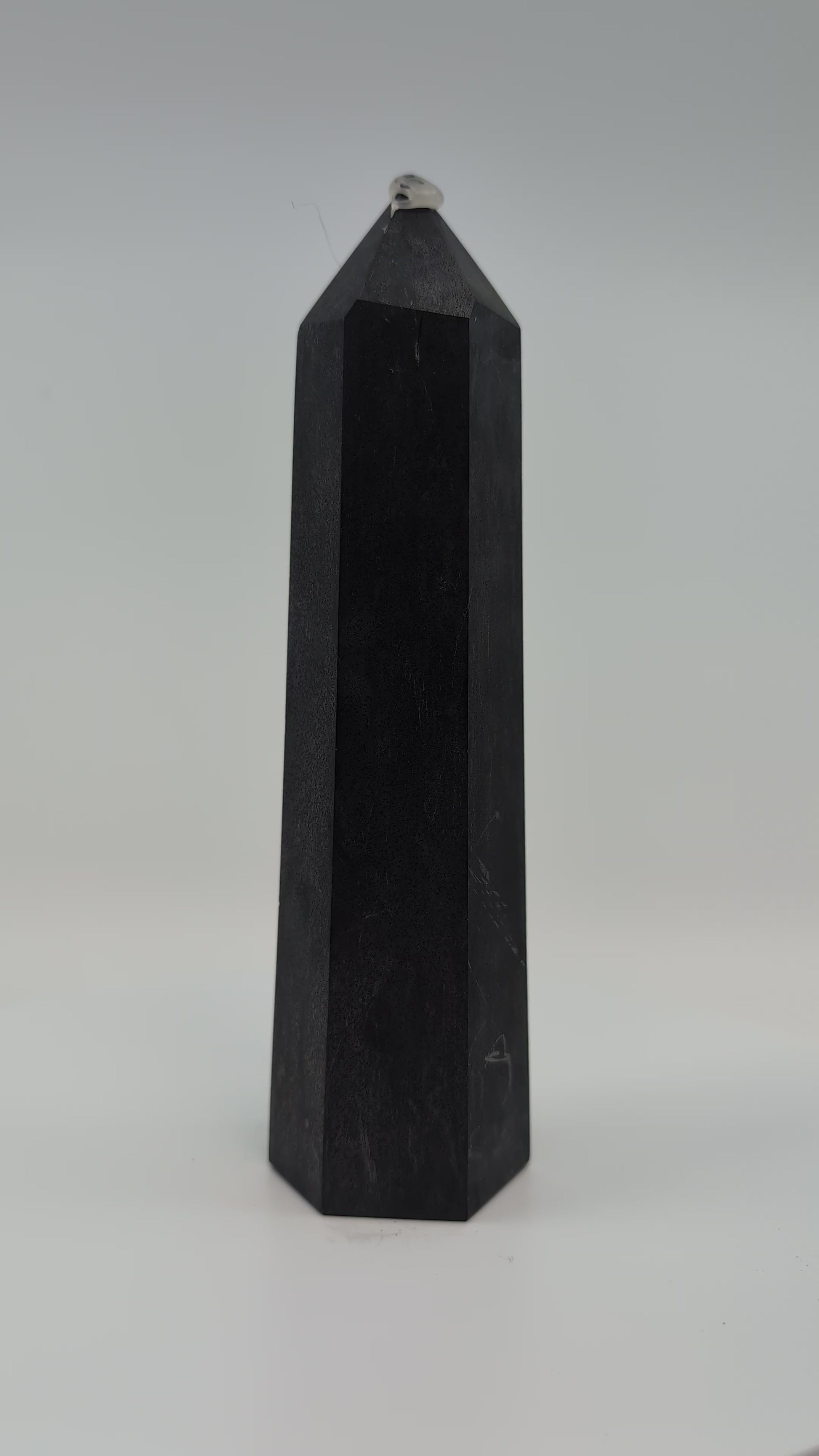 Showcase video of heavy 535g deep-black Shungite tower displaying uniform surface and energy presence.