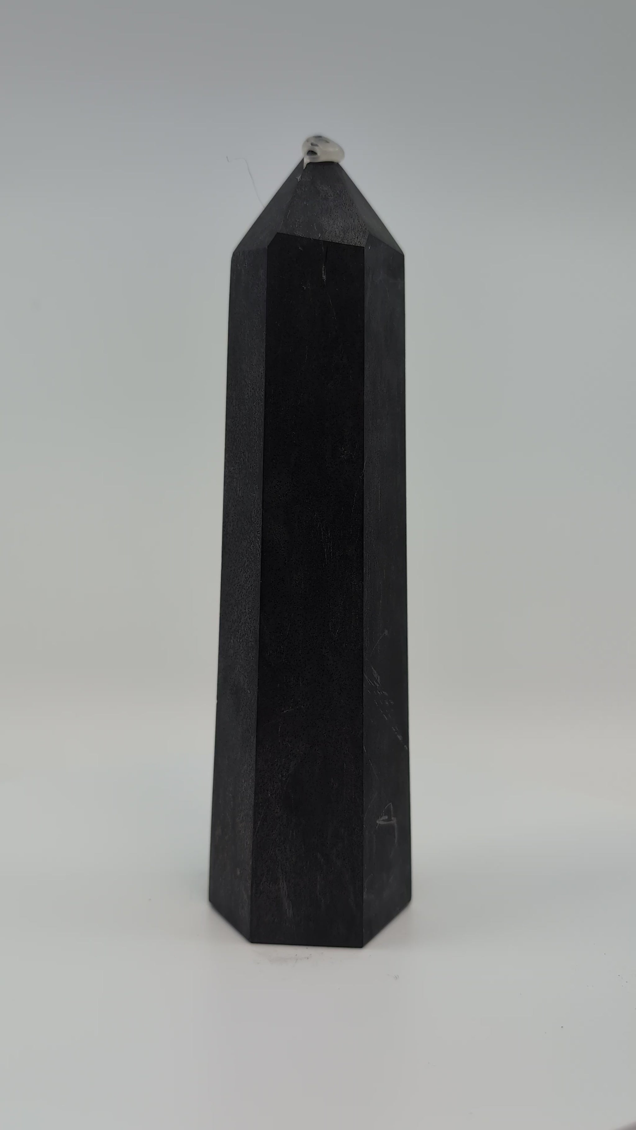 Showcase video of heavy 535g deep-black Shungite tower displaying uniform surface and energy presence.