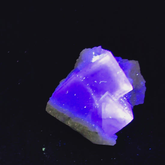 A high-clarity Blue Jelly Fluorite crystal featuring a phantom cube from the renowned Yaogangxian Mine (YGX) in China. This rare mineral specimen glows purple under UV light and is ideal for collectors and energy healers. See full details at Legacy Crystals and Minerals.