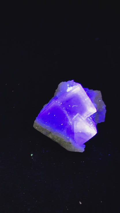 A high-clarity Blue Jelly Fluorite crystal featuring a phantom cube from the renowned Yaogangxian Mine (YGX) in China. This rare mineral specimen glows purple under UV light and is ideal for collectors and energy healers. See full details at Legacy Crystals and Minerals.