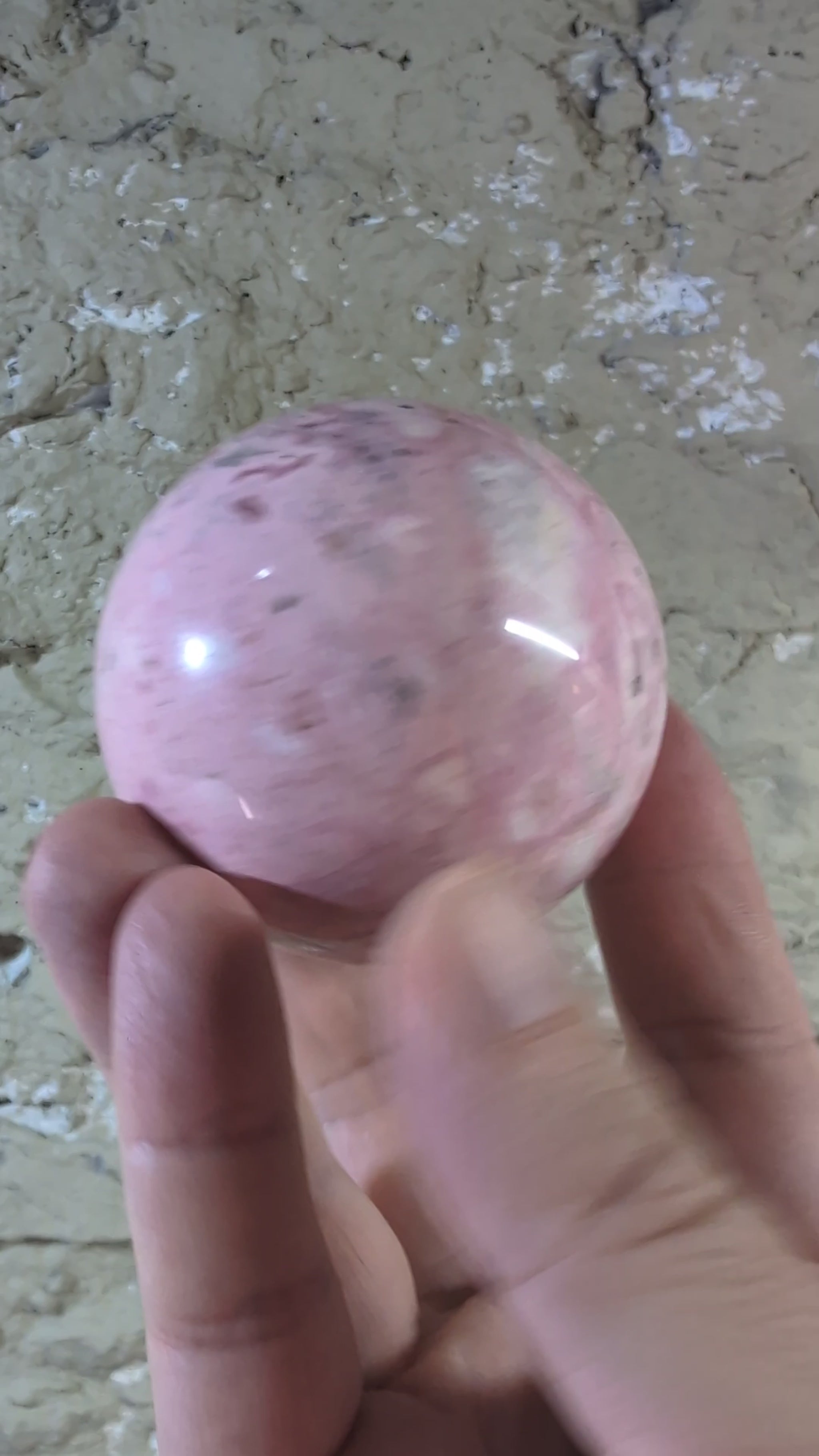 Video of 60 mm 500 g Pink Peruvian Rhodonite sphere