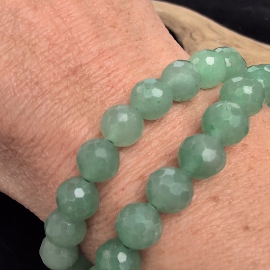 Video demonstrating the 8mm faceted Green Aventurine beaded stretch bracelet in motion, highlighting the light-catching geometric cuts and the natural green aventurescent shimmer.