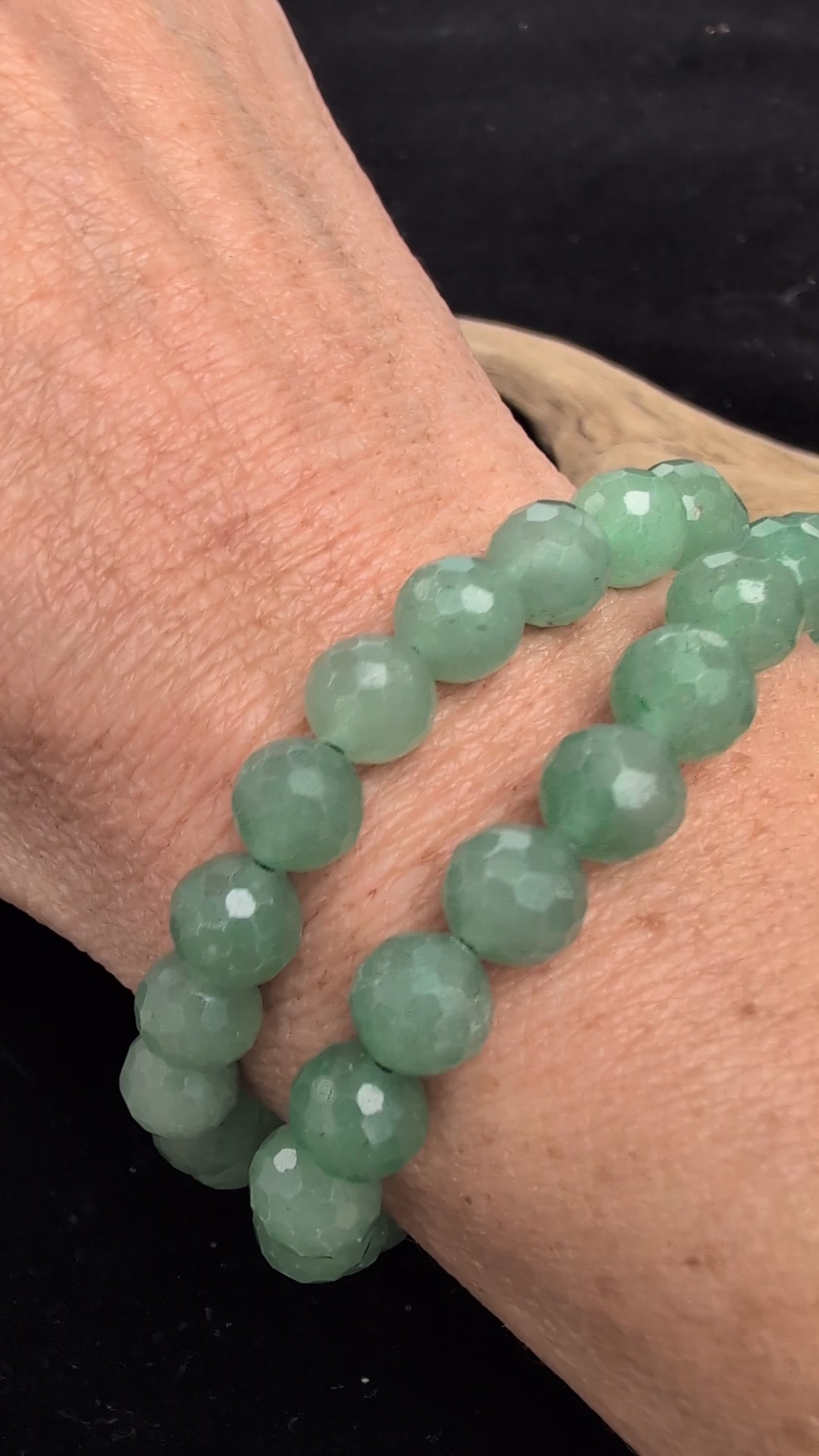 Video demonstrating the 8mm faceted Green Aventurine beaded stretch bracelet in motion, highlighting the light-catching geometric cuts and the natural green aventurescent shimmer.