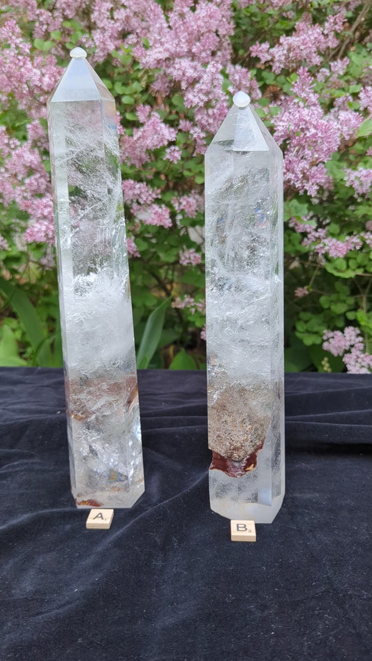 Video of XL Garden Quartz Towers A and B showing polished points, icy internal veils, earthy mineral inclusions, and outdoor scale views